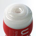 Close-up of Tenga U.s. Original Vacuum Cup Strong showing the soft, textured inner sleeve opening and red outer casing.