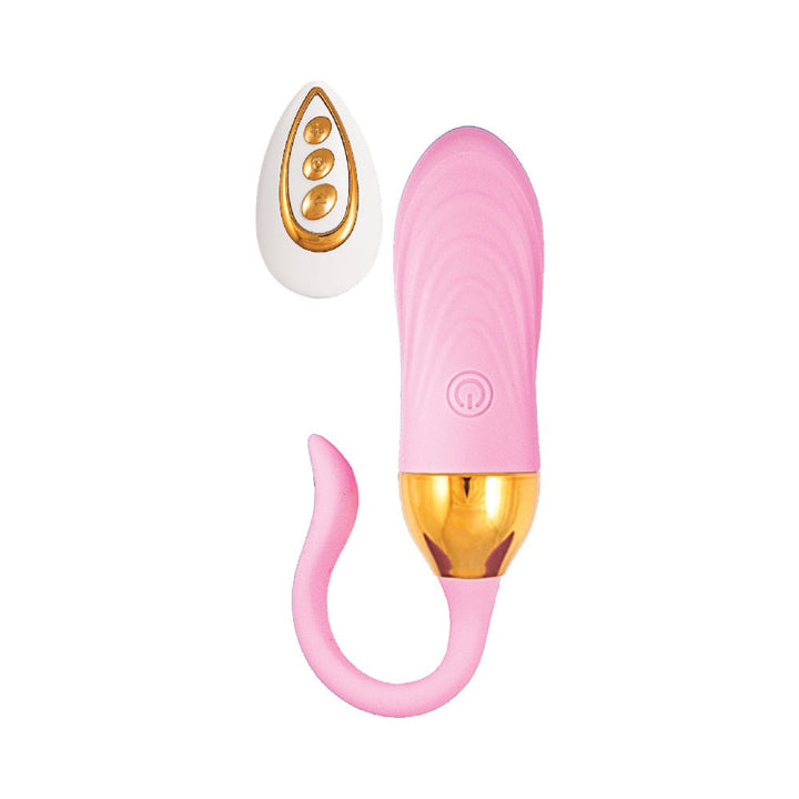 Pink silicone Beat Magic Teaser Plug with gold accents and white remote control with gold buttons on white background.