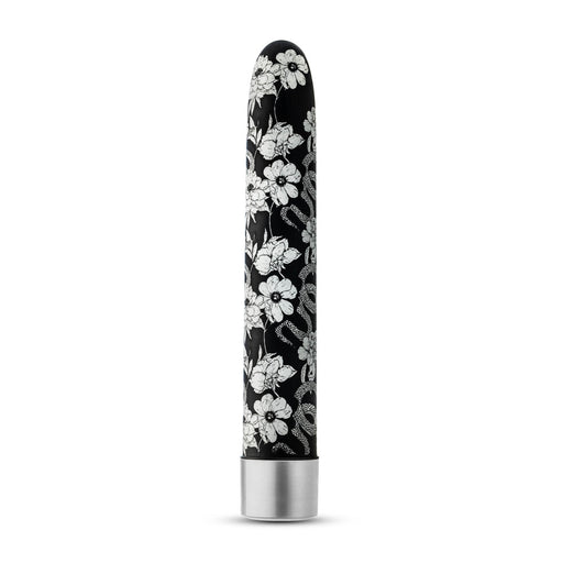 Black slimline vibrator with white floral and snake pattern and silver base, standing upright on white background.
