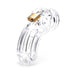 Clear medical-grade polycarbonate male chastity device with brass padlock on white background.