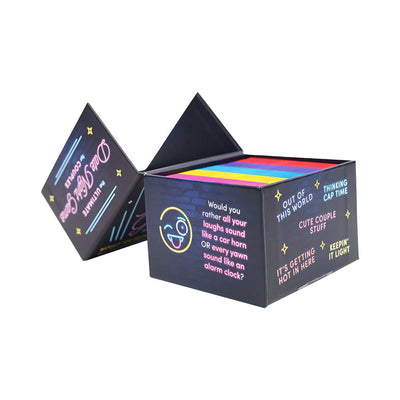 Open box of colorful "Would You Rather?" cards for couples with playful question categories and a fun emoji design on the side.
