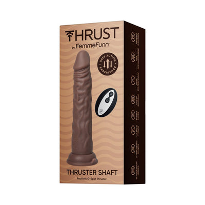 Packaging of Thruster Shaft Thrusting Dildo by FemmeFunn in brown with remote control and product features displayed.
