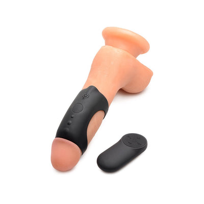Black silicone vibrating cock ring with remote control displayed on a realistic flesh-toned model.