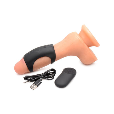 Black silicone vibrating shaft ring displayed on a flesh-colored model with USB charging cable and remote control.