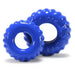 Two blue textured silicone cockrings with a tire tread design, shown on a white background.