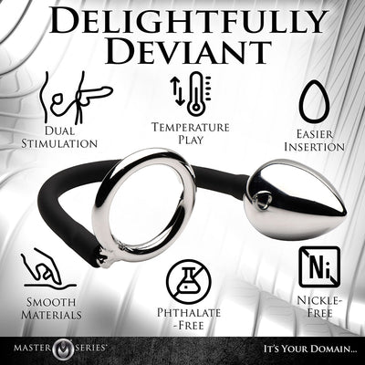 Metal anal plug connected by a black silicone cord to a shiny metal cock and ball ring, highlighting dual stimulation and body-safe features.