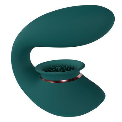 Teal silicone rechargeable vibrator with suction cup and textured stimulation surface, ergonomic curved design.