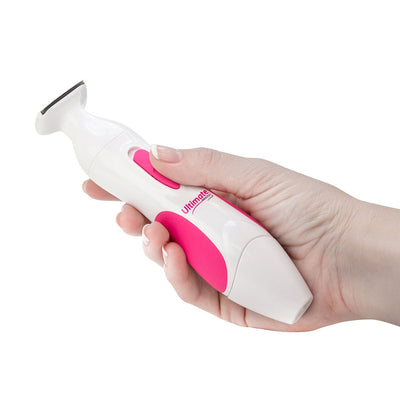 Hand holding a white and pink Ultimate Personal Shaver designed for women with a precision trimming head.
