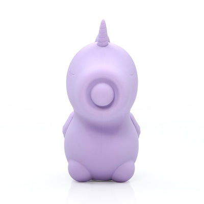 Lilac silicone mini unicorn-shaped vibrator with a circular mouthpiece and closed eyes design, standing upright on white background.