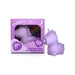 Lilac mini unicorn-shaped vibrator with rhythmic massaging feature displayed next to matching purple packaging.