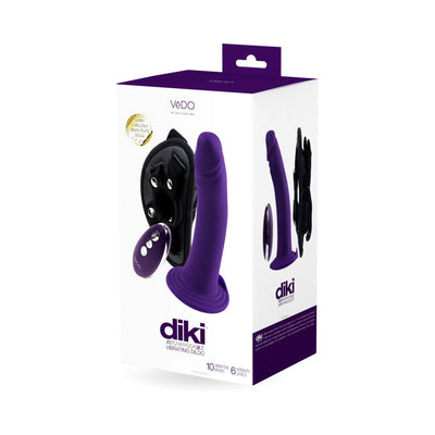 Packaging box of Vedo Diki rechargeable vibrating dildo in deep purple with harness and remote control shown on front and side.