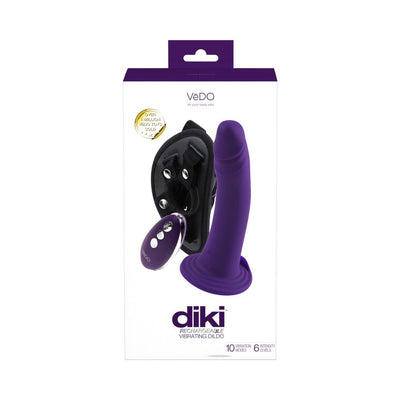 Packaging of Vedo Diki rechargeable deep purple vibrating dildo with harness and remote control shown on white background.