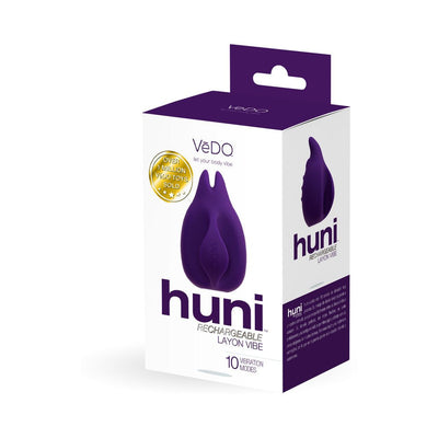 Packaging box of Vedo Huni rechargeable finger vibrator in purple with product image and key features visible.