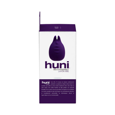 Packaging box of Vedo Huni rechargeable finger vibrator in purple and white with product image and description.