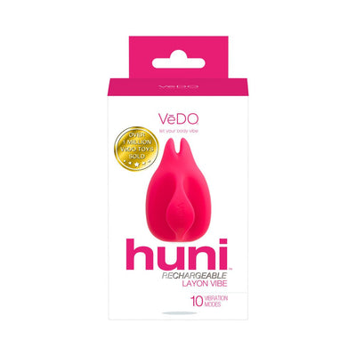 Packaging of Vedo Huni rechargeable finger vibrator in bright pink and white with product image and key features.