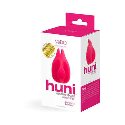 Packaging box of Vedo Huni rechargeable finger vibrator in bright pink and white with product image and features.