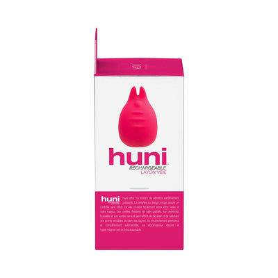 Packaging box of the Vedo Huni Rechargeable Finger Vibe in pink and white with product image and description.