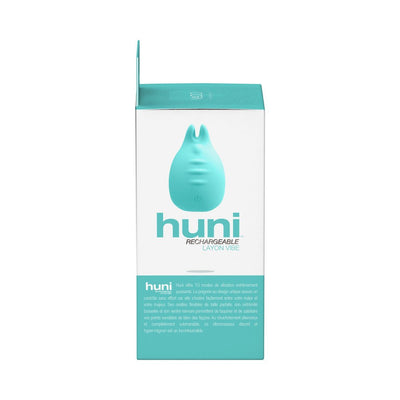 Packaging box of Vedo Huni Rechargeable Finger Vibe in teal and white with product image and description.