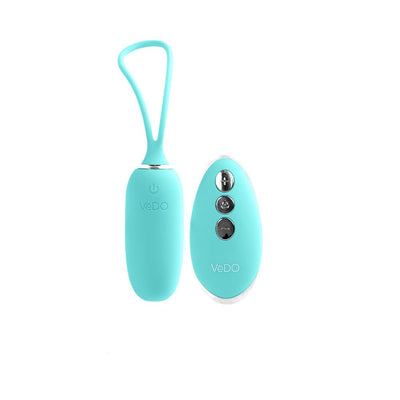 Turquoise VeDO KIWI rechargeable insertable bullet vibrator with matching remote control on white background.