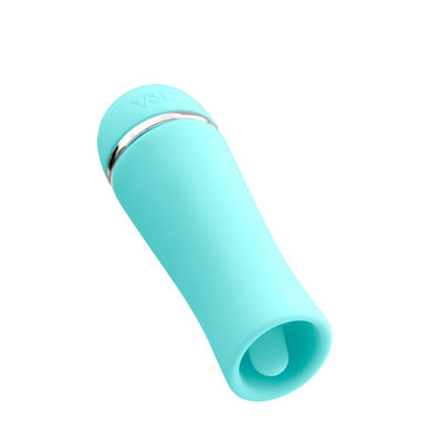 Compact turquoise silicone personal massager with a rounded tip and silver accent ring on a white background.