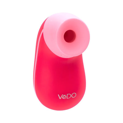 Compact red and pink Vedo Nami rechargeable sonic vibe with a soft silicone tip and ergonomic design.