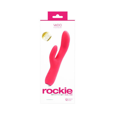 Pink Vedo Rockie rechargeable dual motor silicone vibrator with curved design for G-spot and clitoral stimulation in retail packaging.