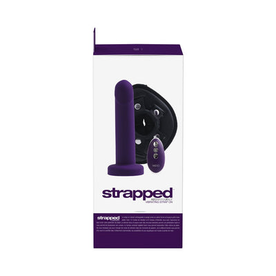 Packaging of Vedo Strapped rechargeable vibrating strap-on in deep purple with adjustable harness and remote control.