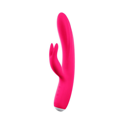 Bright pink rechargeable dual-motor vibrator with flexible shaft and clitoral stimulator shaped like bunny ears.
