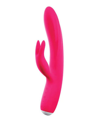 Bright pink rechargeable dual-motor vibrator with flexible shaft and clitoral stimulator shaped like bunny ears.