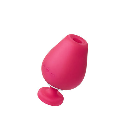 Pink rechargeable vibrating sonic vibe with a smooth silicone finish and suction base.