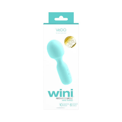 Light blue Vedo Wini rechargeable mini wand in white retail packaging with product features and gold seal.