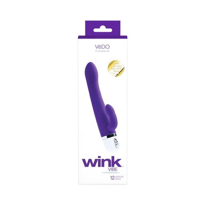Purple VeDO Wink Vibe dual motor vibrator with curved head and flexible clitoral stimulator in white and purple packaging.