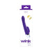 Purple VeDO Wink Vibe dual motor vibrator with curved head and flexible clitoral stimulator in white and purple packaging.