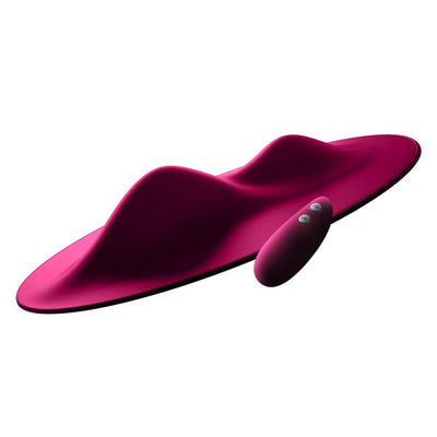 Ergonomic magenta silicone VibePad with dual motors and wireless remote control for customizable external stimulation.