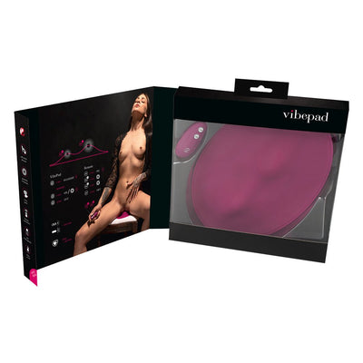 Vibepad product packaging showing the pink ergonomic silicone stimulator and remote control with usage instructions and model image inside the box.