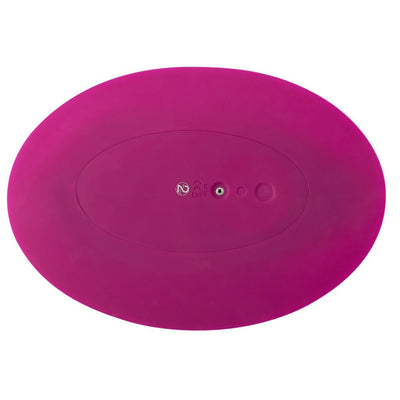 Oval-shaped magenta silicone VibePad with power button and charging port on the back side.