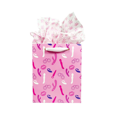 Pink gift bag with playful vibrator and accessory prints, white ribbon handle, and pink patterned tissue paper.