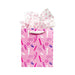 Pink gift bag with playful vibrator and accessory prints, white ribbon handle, and pink patterned tissue paper.