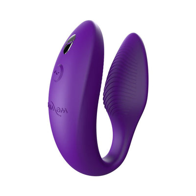 Purple We-Vibe Sync couples vibrator with adjustable, curved design and textured silicone surface.