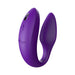 Purple We-Vibe Sync couples vibrator with adjustable, curved design and textured silicone surface.