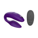 Purple We-Vibe Sync adjustable couples vibrator with textured silicone and black remote control on white background.