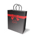 Black gift bag with red ribbon and bow design and "With Love" text, featuring gray rope handles.