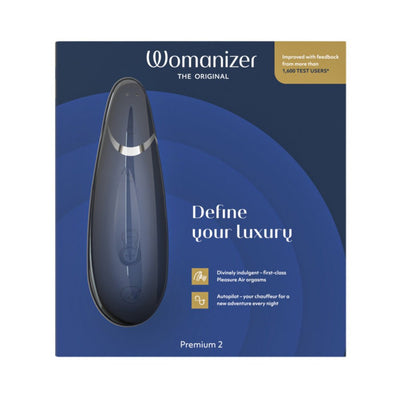 Womanizer Premium 2 clitoral stimulator in sleek blue packaging with product image and luxury features highlighted.