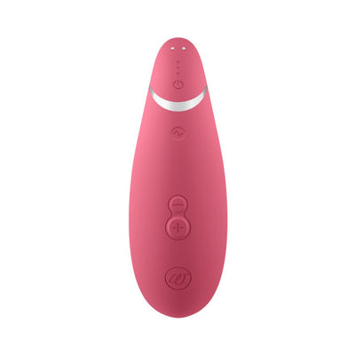 Pink Womanizer Premium 2 clitoral stimulator with ergonomic design and multiple control buttons on a white background.