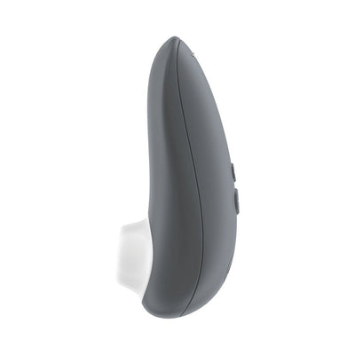 Gray Womanizer Starlet 3 clitoral stimulator with silicone head and ergonomic design, side view on white background.