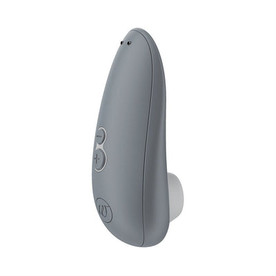 Gray Womanizer Starlet 3 clitoral stimulator with ergonomic design and control buttons on the side.