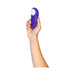 Hand holding a compact Womanizer Starlet 3 clitoral stimulator in violet with a white silicone head.