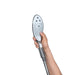 Hand holding the sleek Womanizer Wave shower head with multiple jet nozzles and ergonomic design against a white background.
