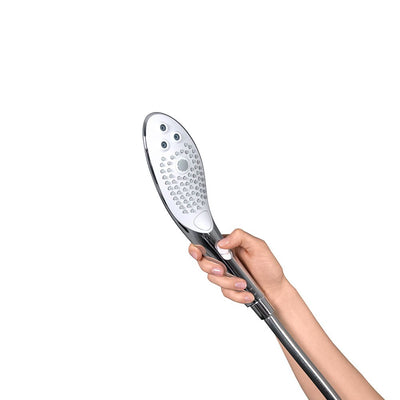 Hand holding the sleek chrome Womanizer Wave shower head with multiple water jet nozzles and ergonomic button control.