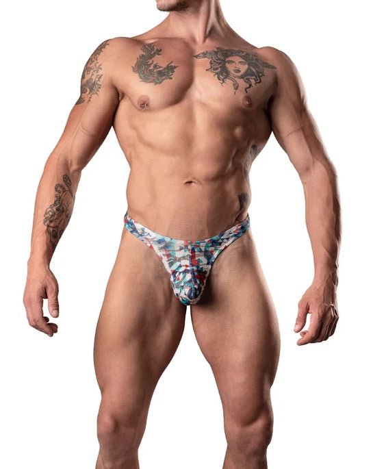 Male model wearing red, white, and blue low-cut thong with narrow contoured pouch and classic T-back design
